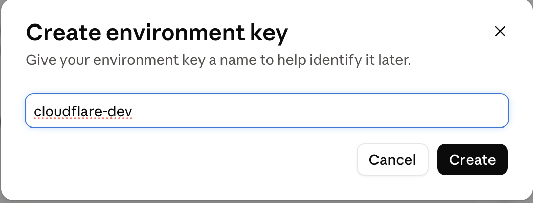 Anthropic Claude Platform 'Create environment key' modal with the name field set to cloudflare-dev